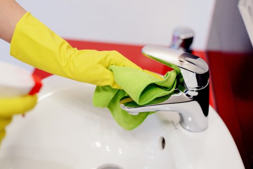 Cleaner inspecting high-touch areas during deep cleaning in EC1
