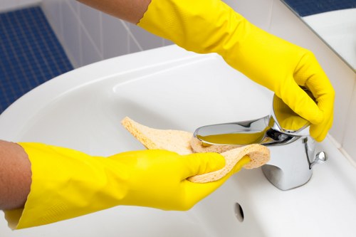 Cleaner treating a carpet in a modern EC1 property